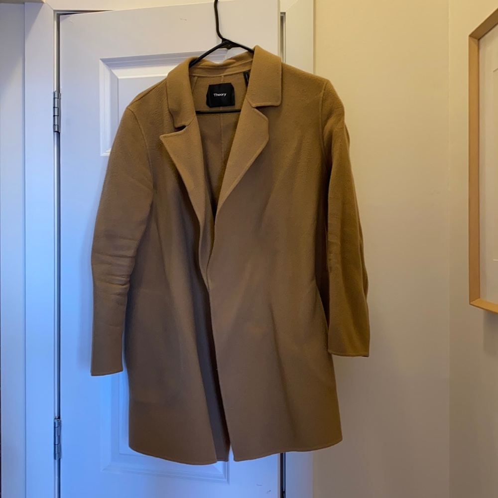 Well loved light coat that goes with everything and can be worn in all seasons.